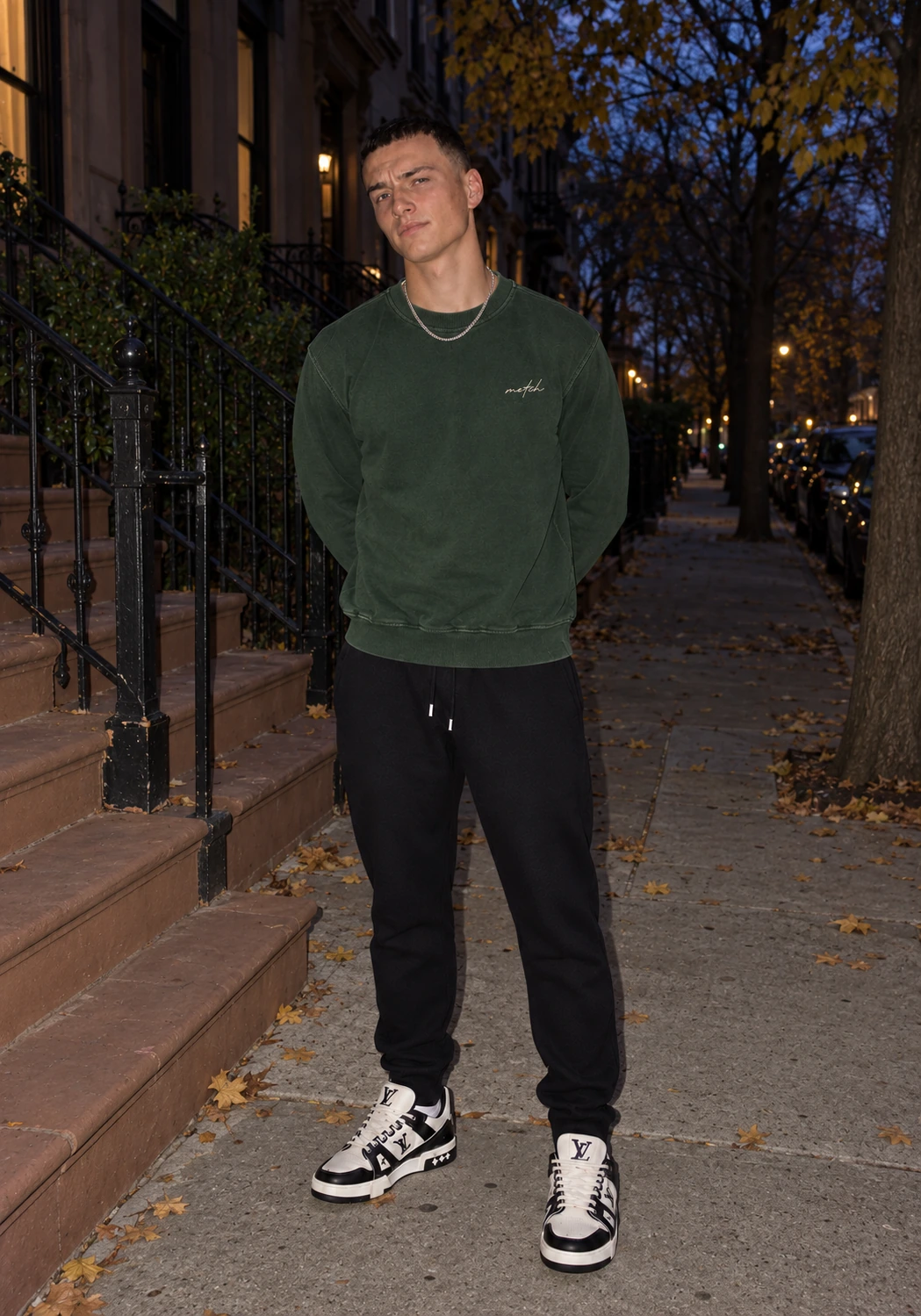 Harvest forest-green sweatshirt worn outside at dusk
